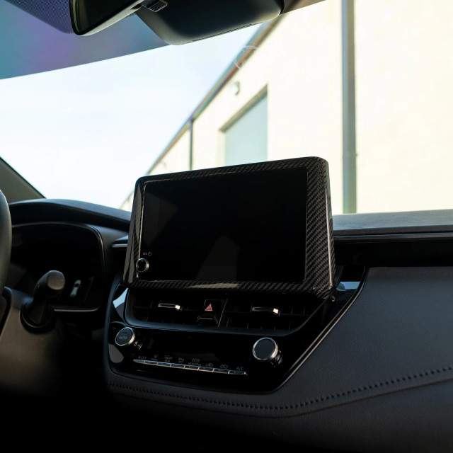Driven.Media Carbon Fiber Radio Bezel for the GR Corolla 2023+ — 3